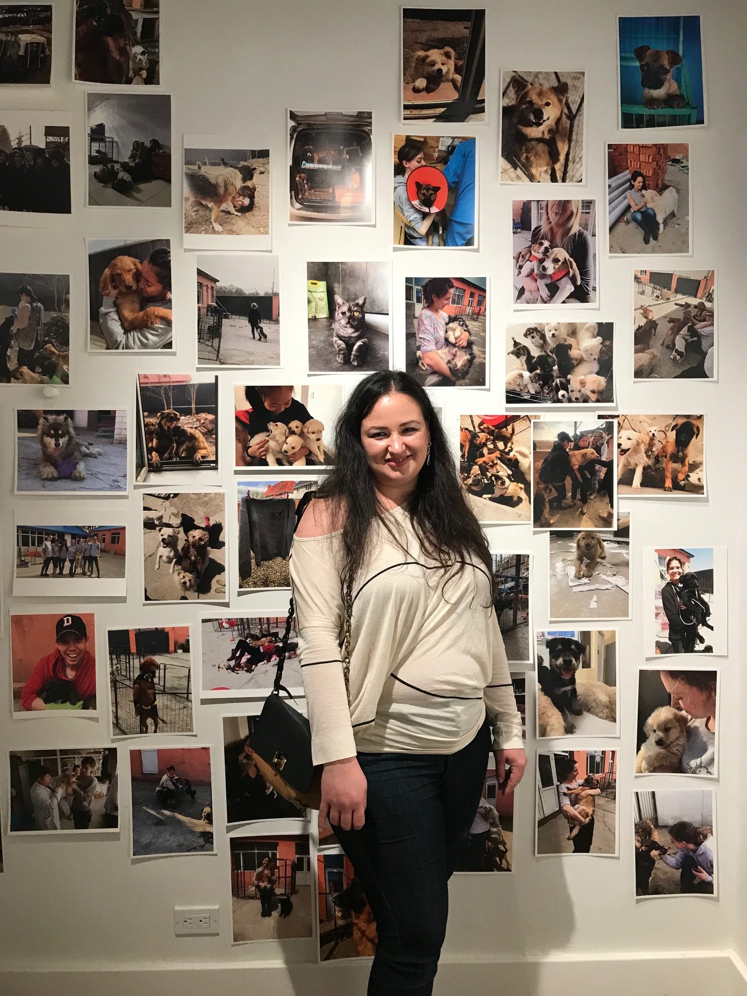 Monica with pictures of animals behind her